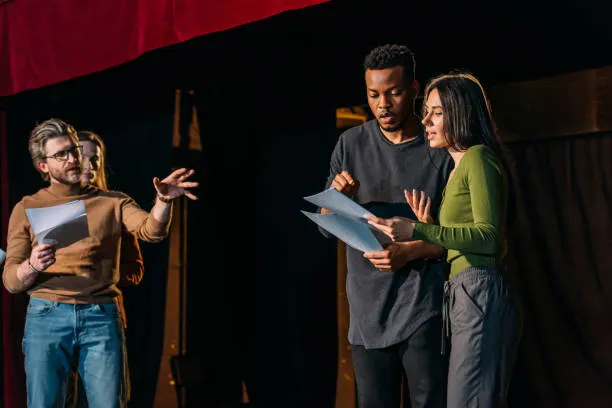 theater-director-multicultural-actors-and-actress-rehearsing-on-stage.png